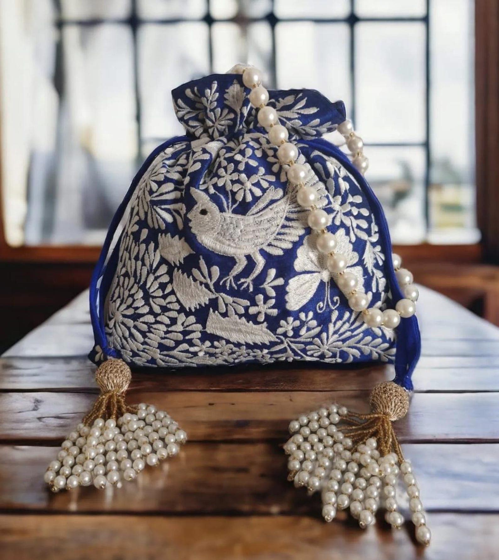 Handwoven Bird Red and Blue Potli Bags with Pearl Handles